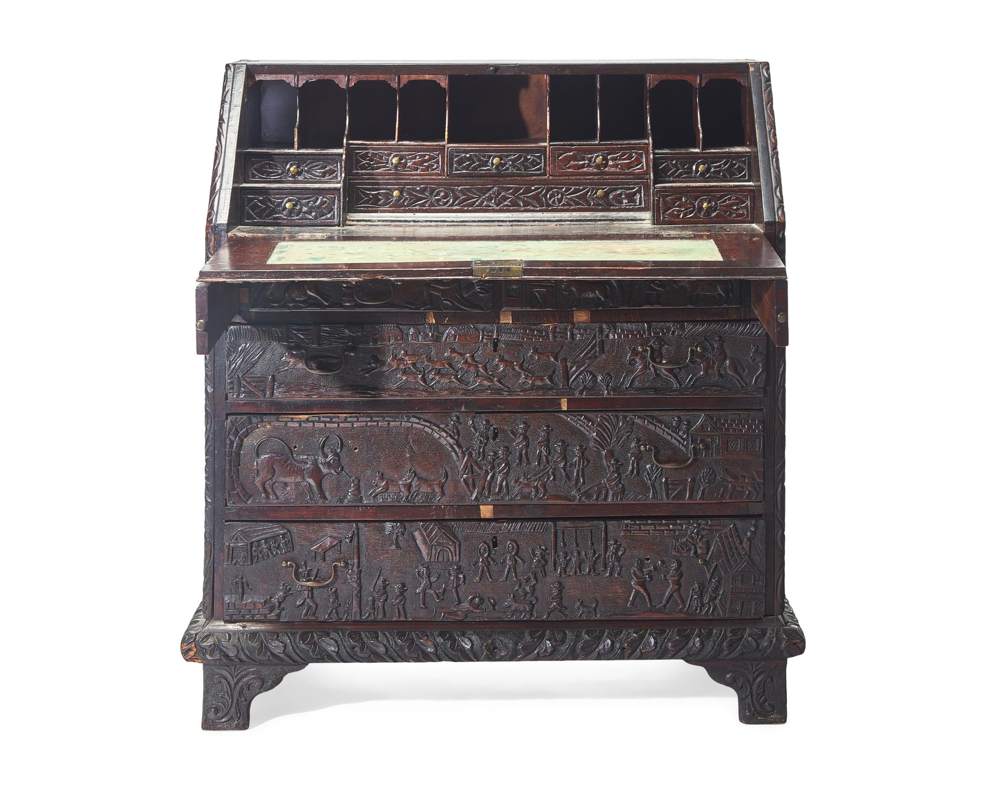 An English Relief-Carved Oak Slant-Front Desk