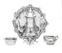 An American Silver Three-Piece Tea Service, Norma Lambert, 1977/1978, comprising a kettle on stand, a creamer, a waste bowl and a tray.