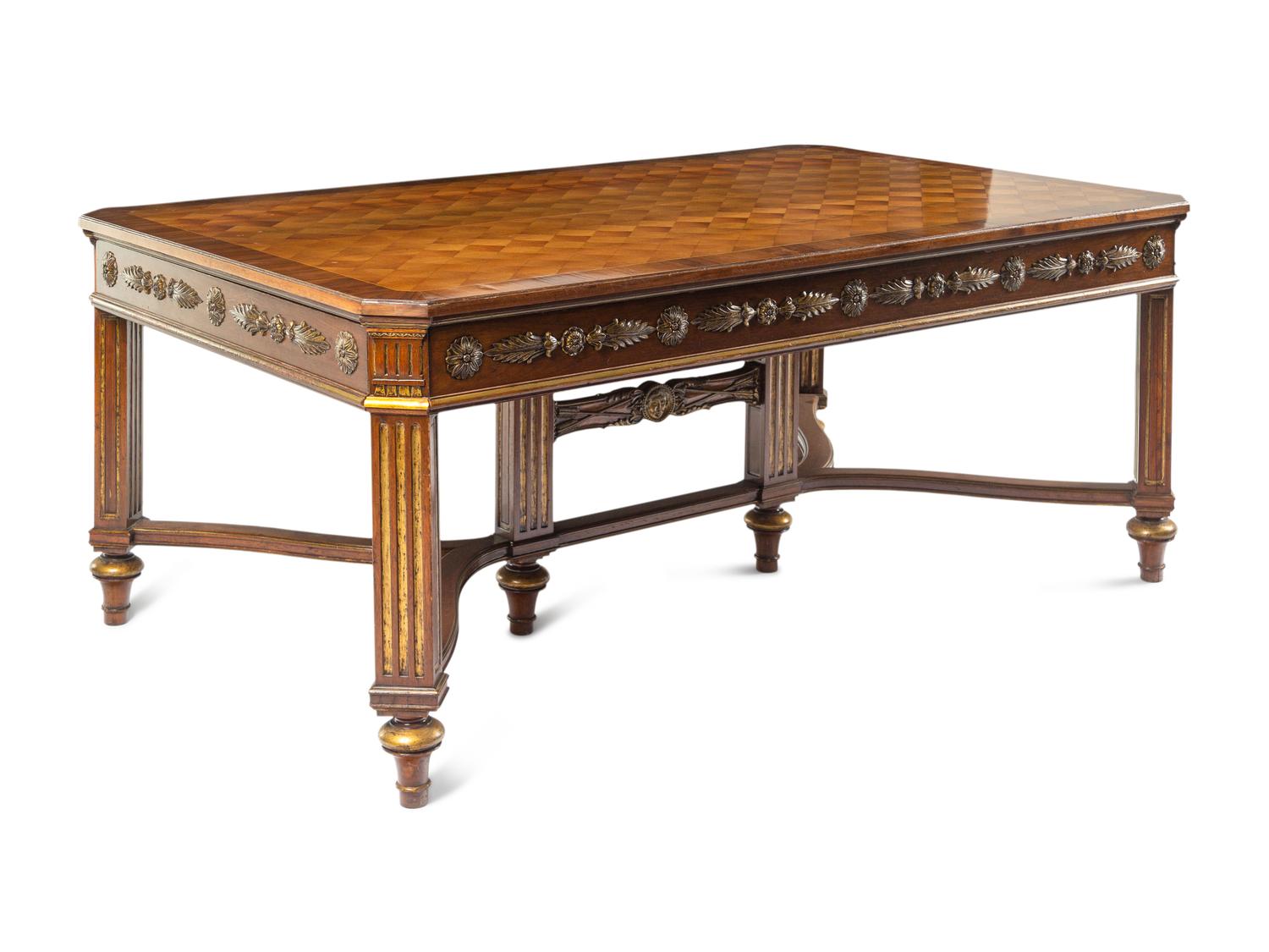 A Louis XVI Style Parcel Gilt Parquetry and Walnut Dining Table