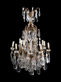 A Louis XV Style Bronze and Glass Twelve-Light Chandelier