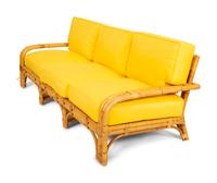 A Bielecky Brothers Rattan Settee with Two End Tables and a Pair of Ottomans
