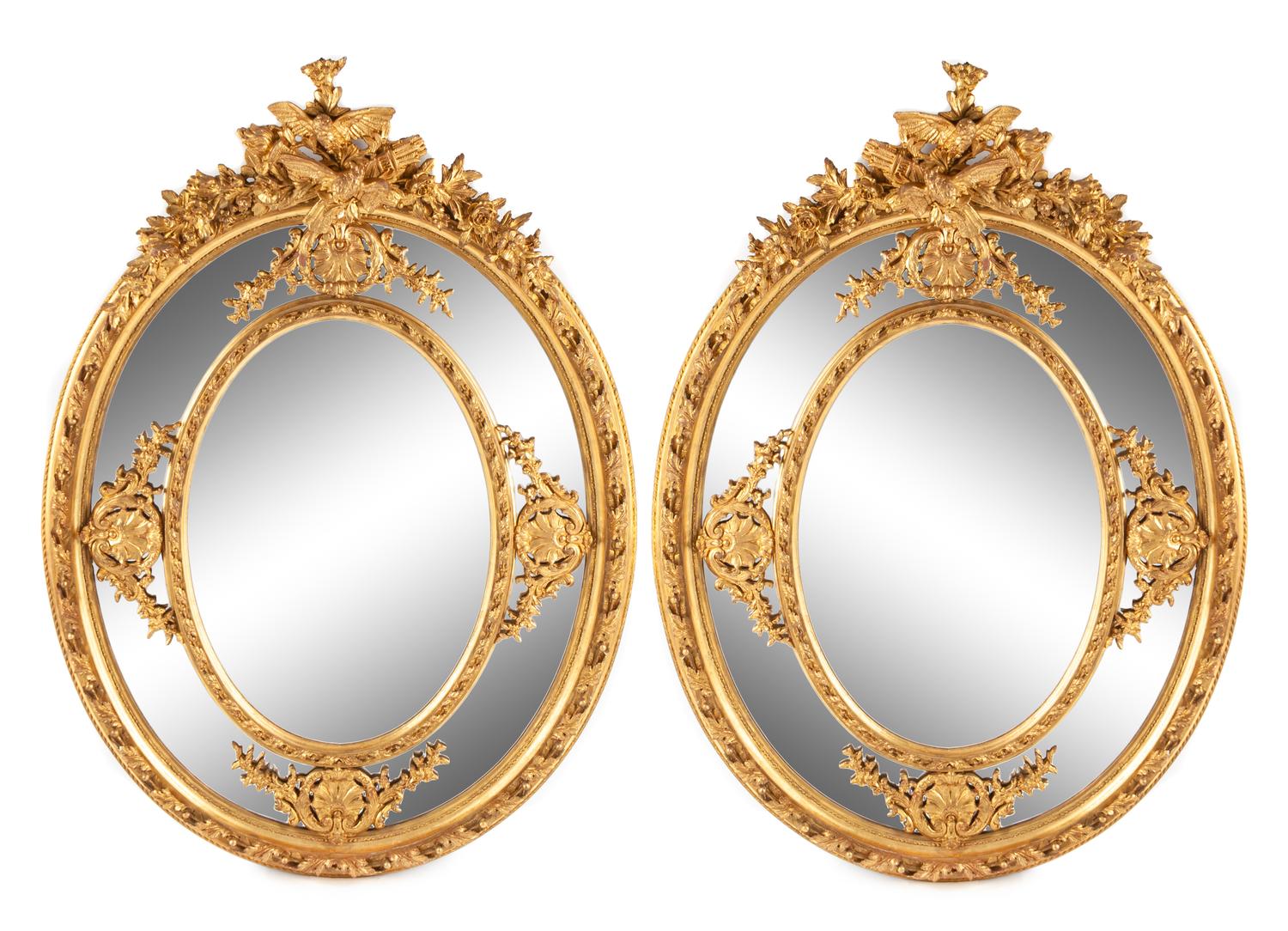 A Pair of Large Louis XV Style Giltwood and Gesso Mirrors Height 73 1/2 x width 53 inches.