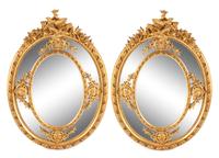 A Pair of Large Louis XV Style Giltwood and Gesso Mirrors Height 73 1/2 x width 53 inches.