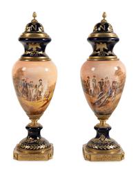 A Pair of Gilt Bronze Mounted Sèvres Style Porcelain Urns