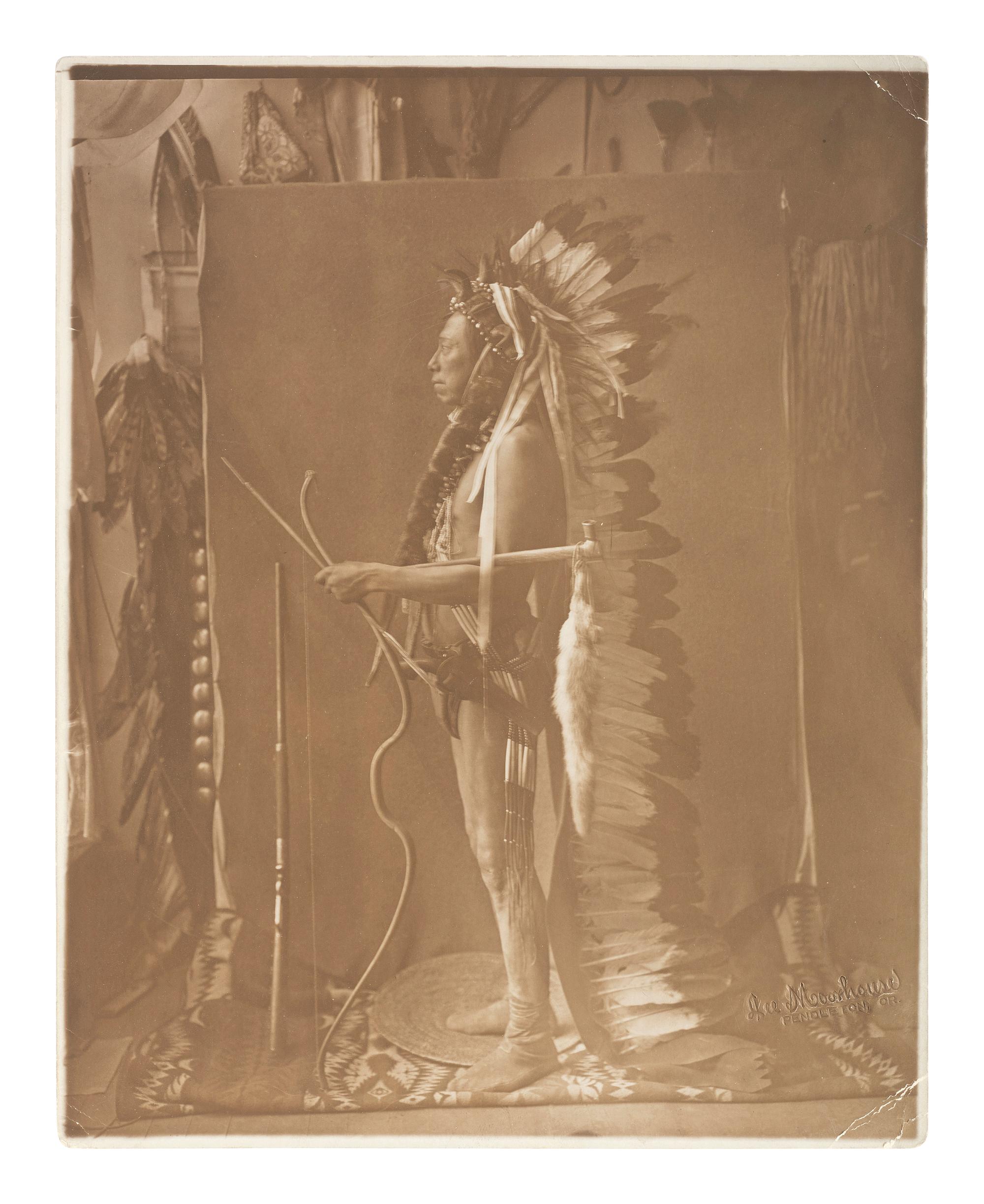 Native Americans MOORHOUSE, Lee (1850-1926), photographer. Standing profile studio portrait of a Native American male subject. Pendleton, OR: n.d.