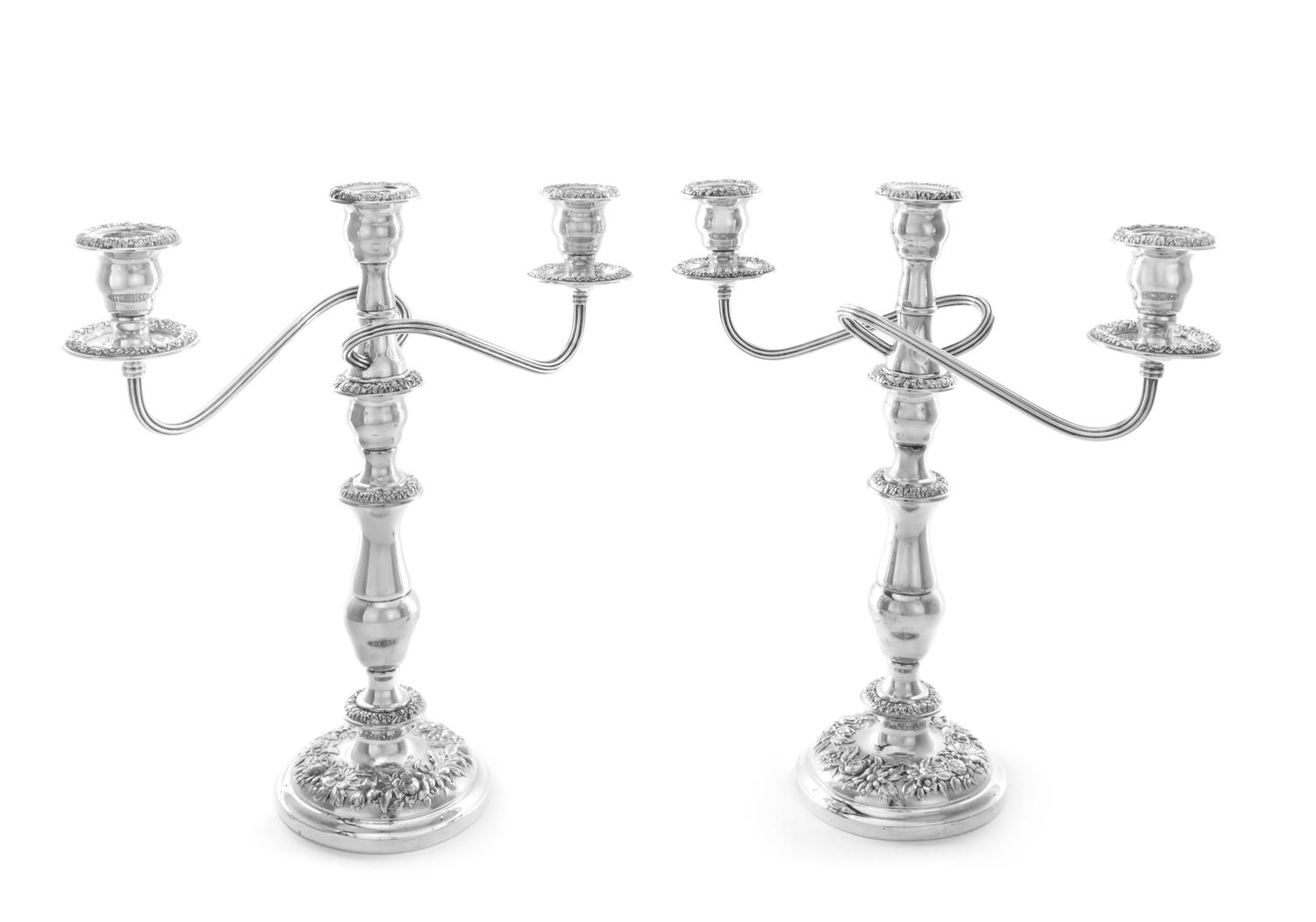 A Pair of American Silver Three-Light Candelabra, S. Kirk & Son, Baltimore, MD, the central urn form candle cup having a repousse flora