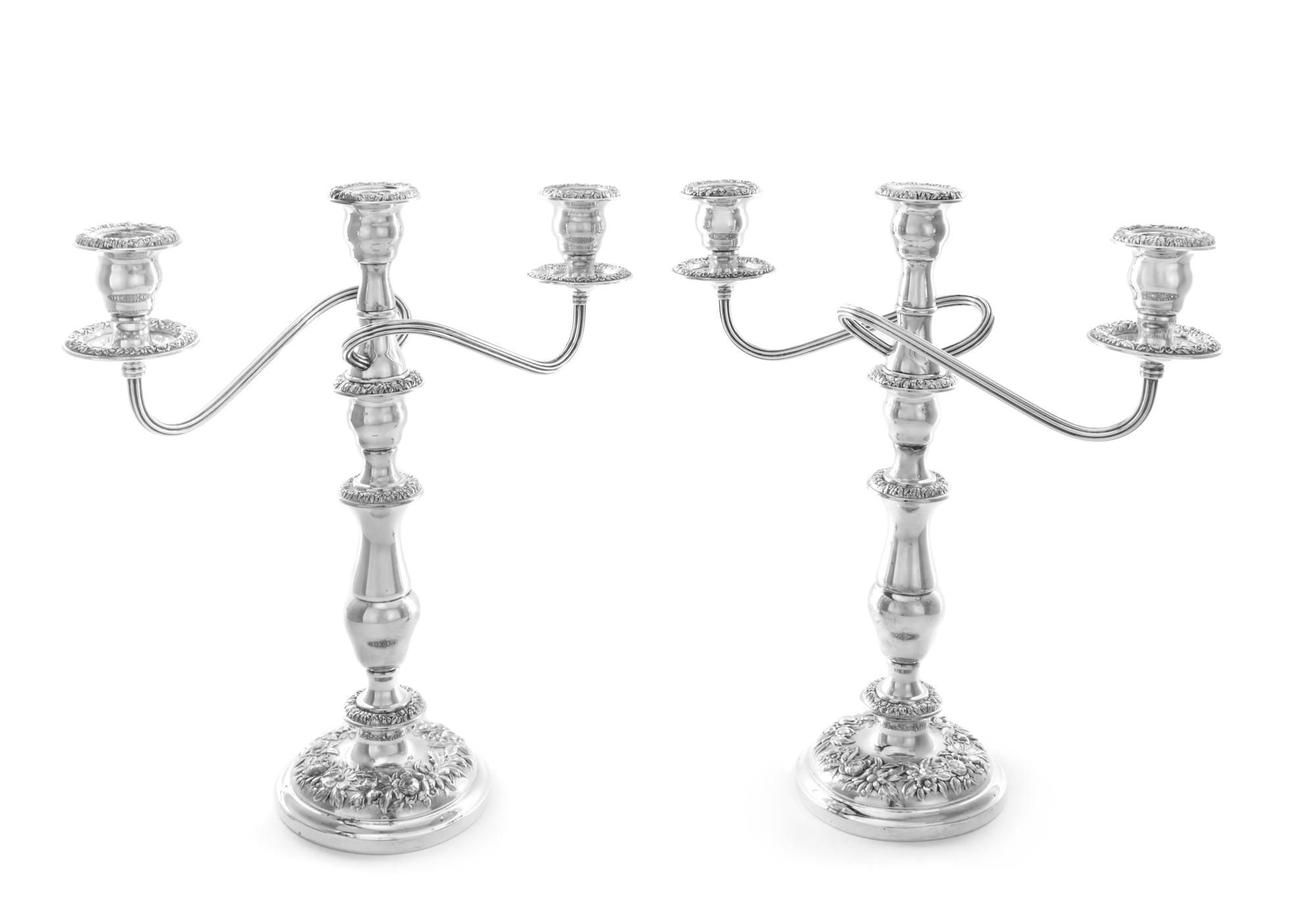 A Pair of American Silver Three-Light Candelabra, S. Kirk & Son, Baltimore, MD, the central urn form candle cup having a repousse flora