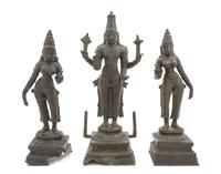 A South Indian Bronze Group of Vishnu with Shridevi and Bhudevi CHOLA PERIOD, 11TH/12TH CENTURY Height of tallest 17 1/4 inches. — CHOLA PERIOD, 11TH/12TH CENTURY