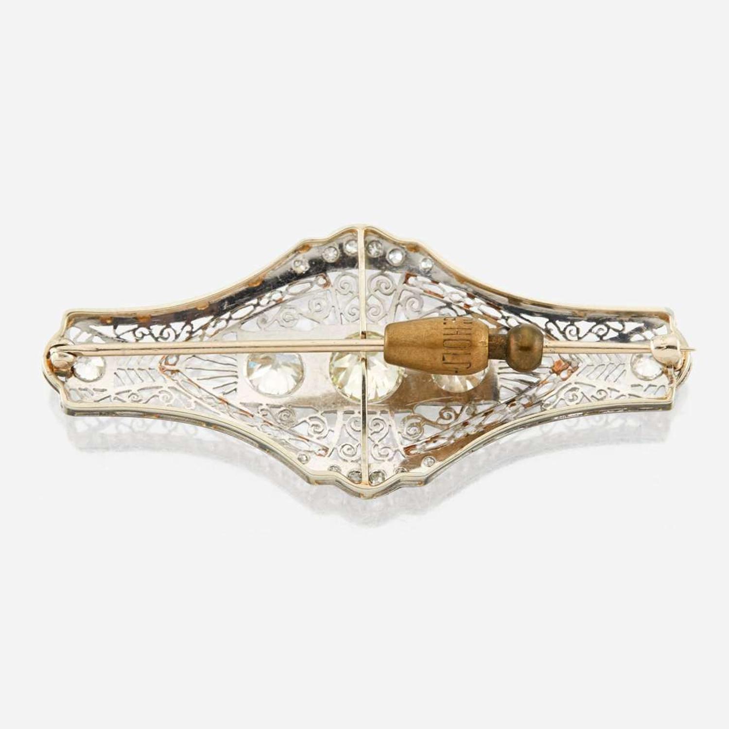 A diamond and white gold brooch