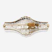 A diamond and white gold brooch