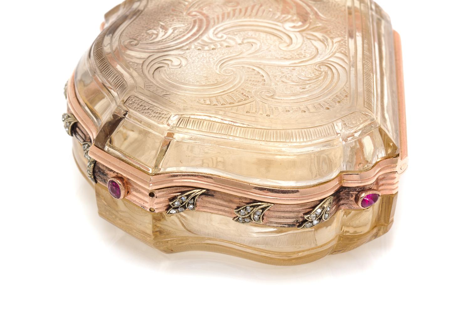 A Russian Gold Mounted and Jeweled Carved Topaz Box, St. Petersburg, 19th Century, of shield form with incised rocaille decoration, wit