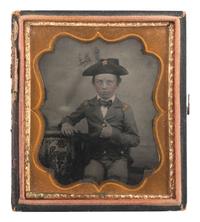 [EARLY PHOTOGRAPHY]. A pair of portraits of young boys dressed in military attire.