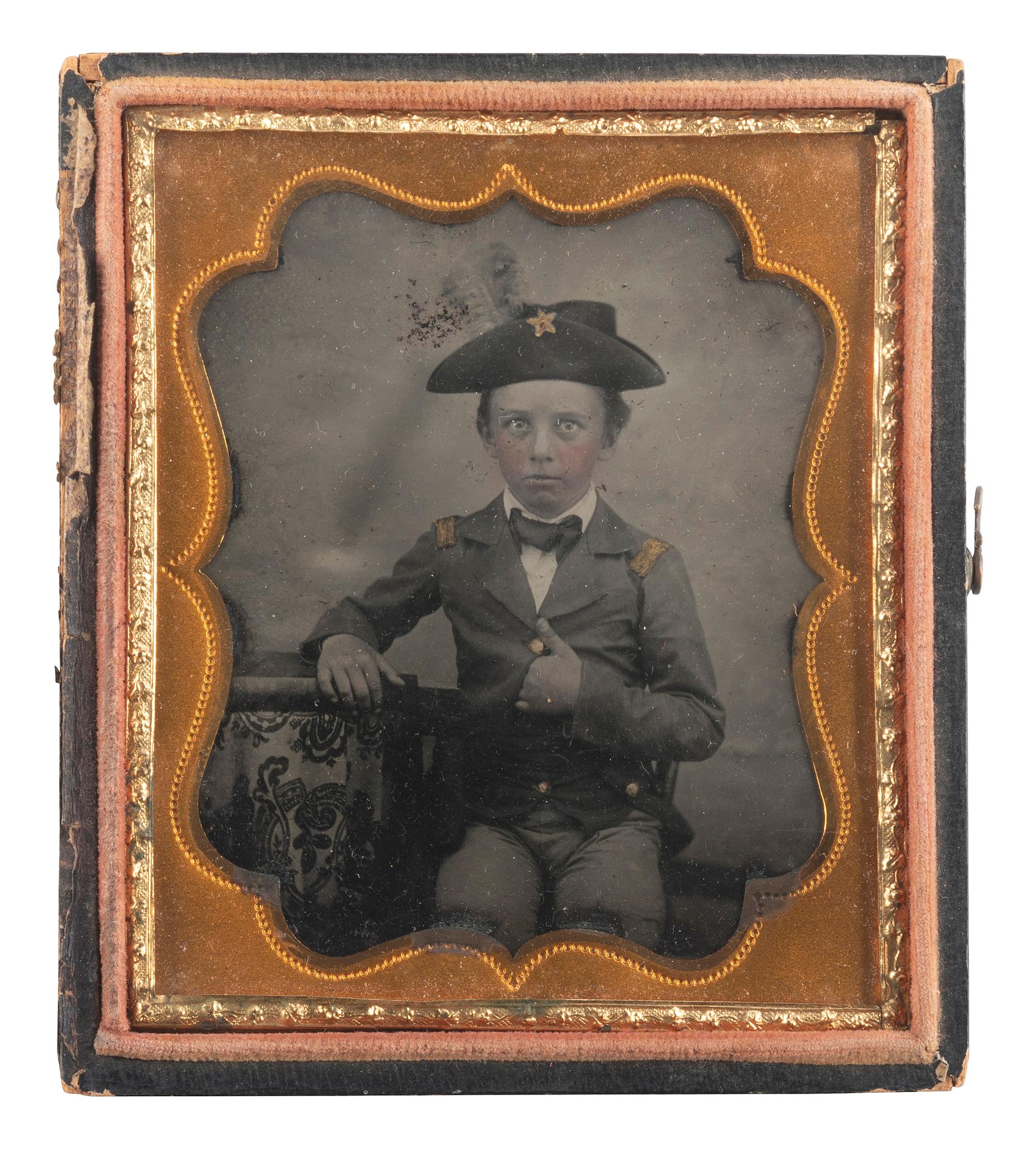 [EARLY PHOTOGRAPHY]. A pair of portraits of young boys dressed in military attire.