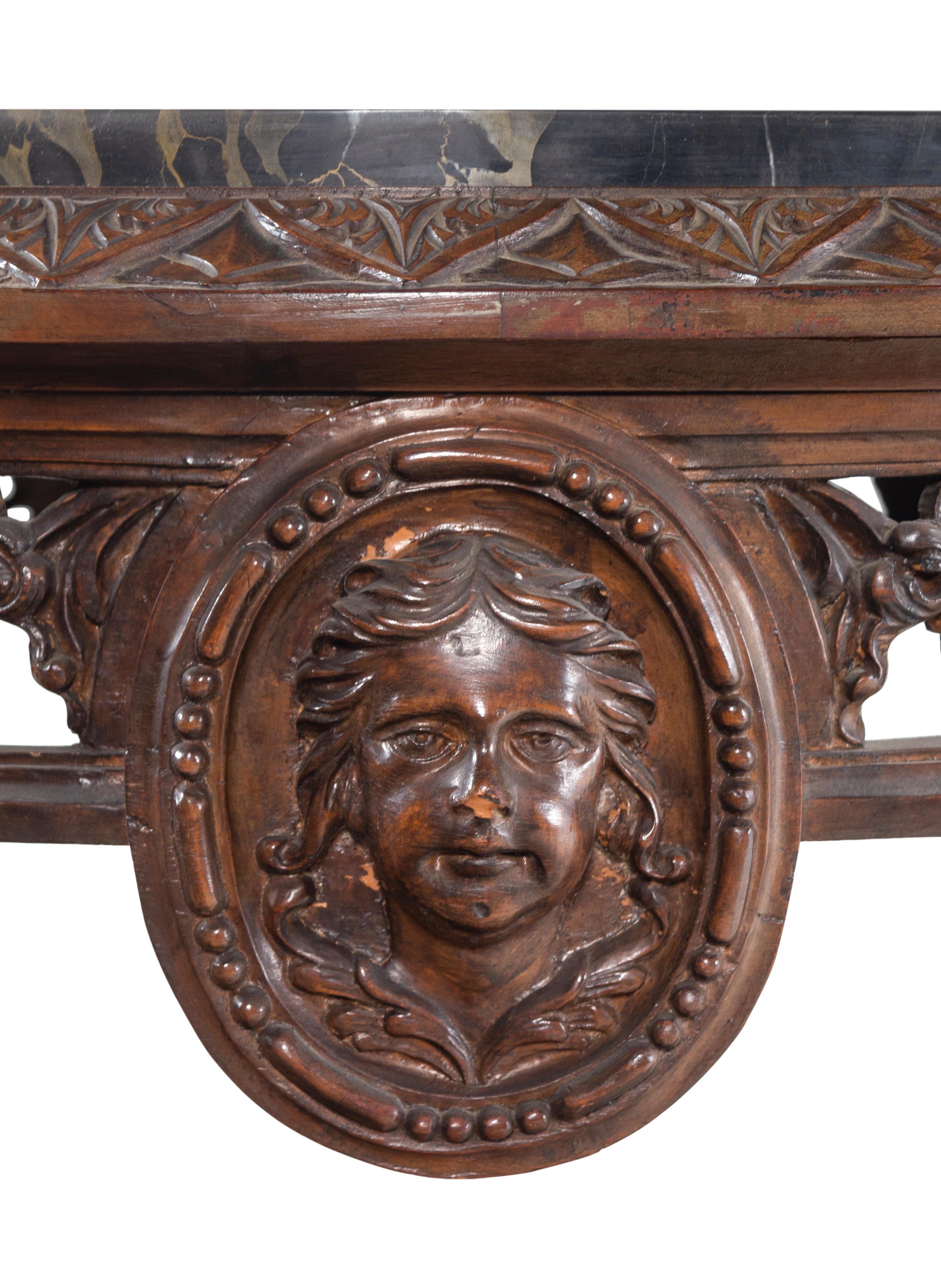 An Italian Carved Walnut Marble-Top Table