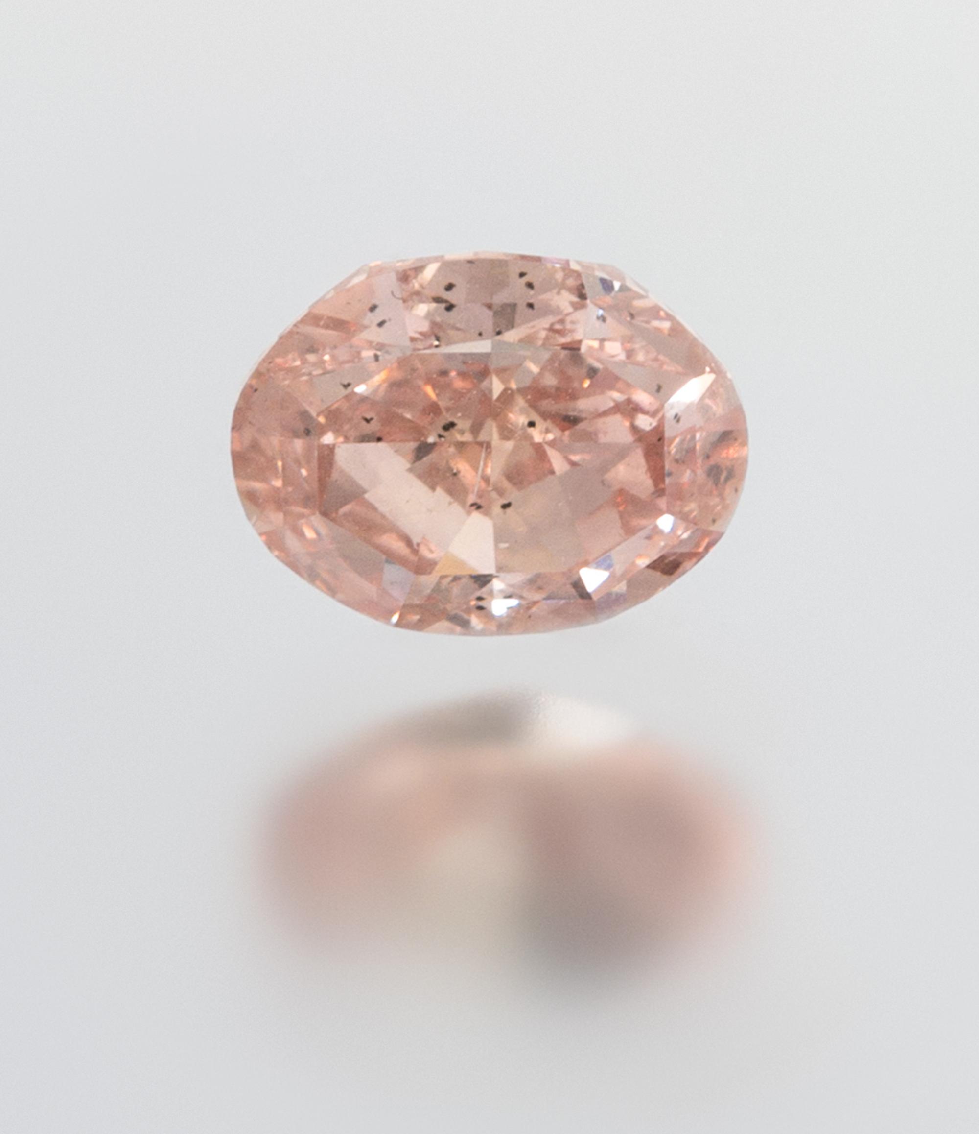A 2.58 Carat Oval Mixed Cut Fancy Orangy Pink Diamond,