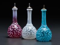 Three Coral Opalescent Glass Barber Bottles