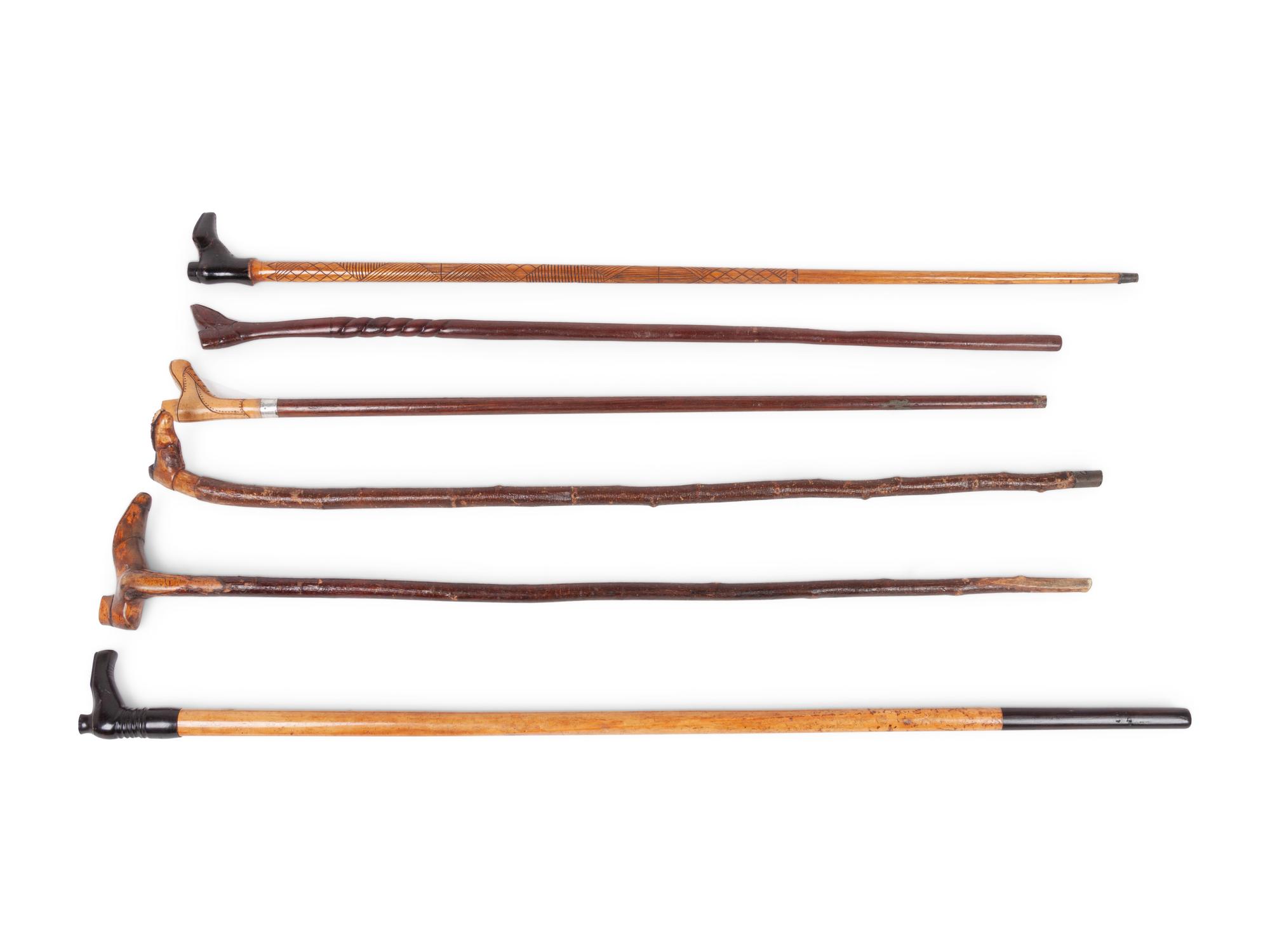 A Group of Folk Art Carved Shoe-Form Canes