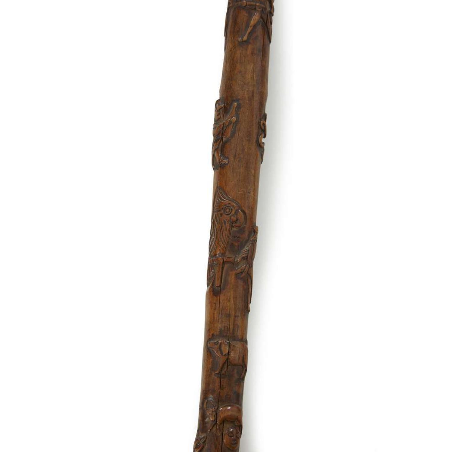 Group of seven carved wood canes with figural and patriotic motifs American and Mexican, late 19th/20th century