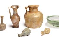 A Group of Nine Roman, Sidonian, and Islamic Glass Vessels