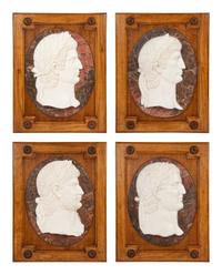 A Set of Four Carved Marble Profile Medallions of Roman Emperors