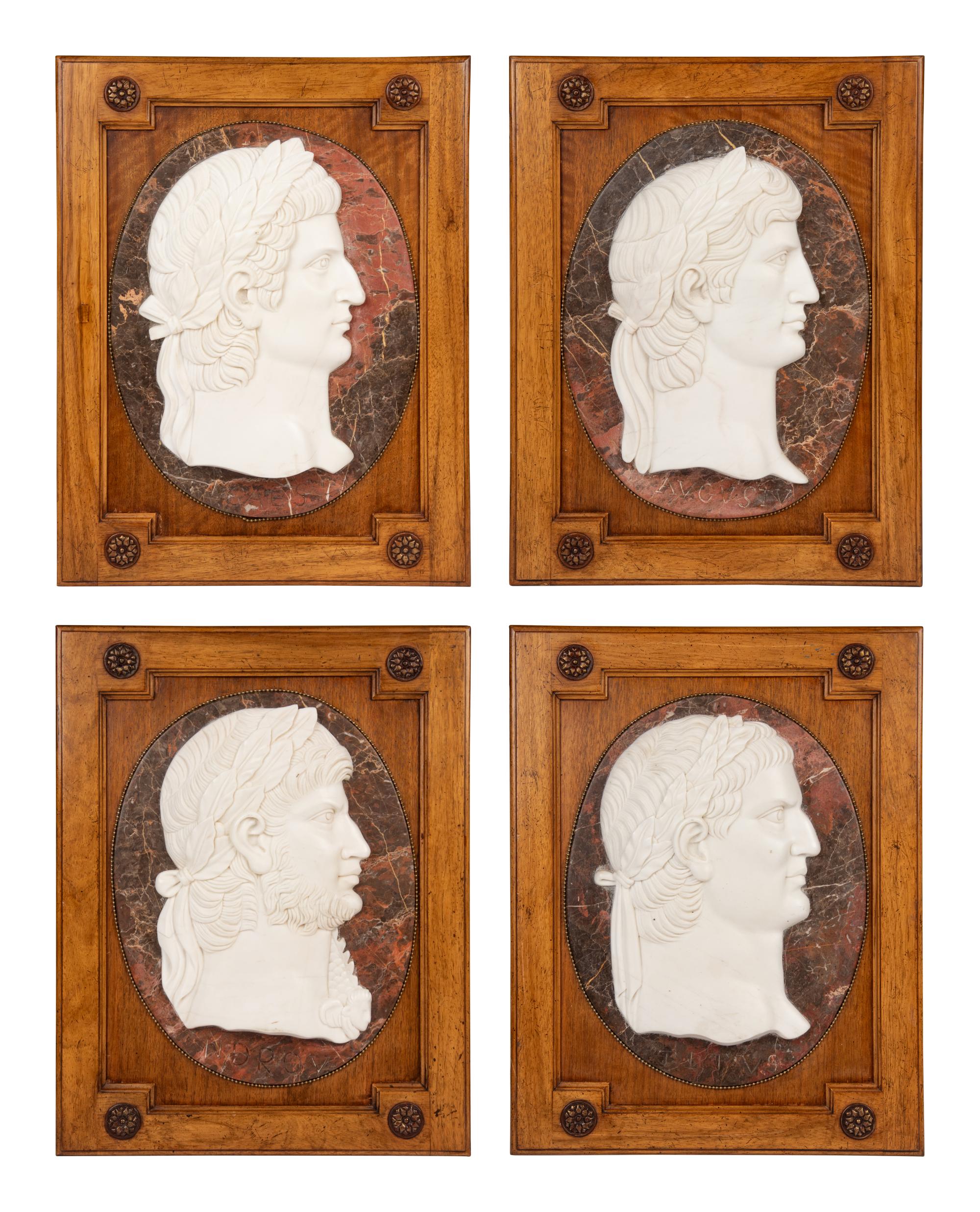 A Set of Four Carved Marble Profile Medallions of Roman Emperors
