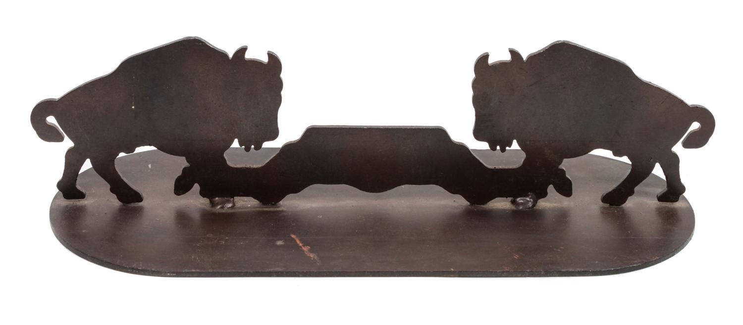 A Pair of Iron Door Stops Depicting Bison in Profile Each height 5 3/4 x width 21 x depth 8 inches.