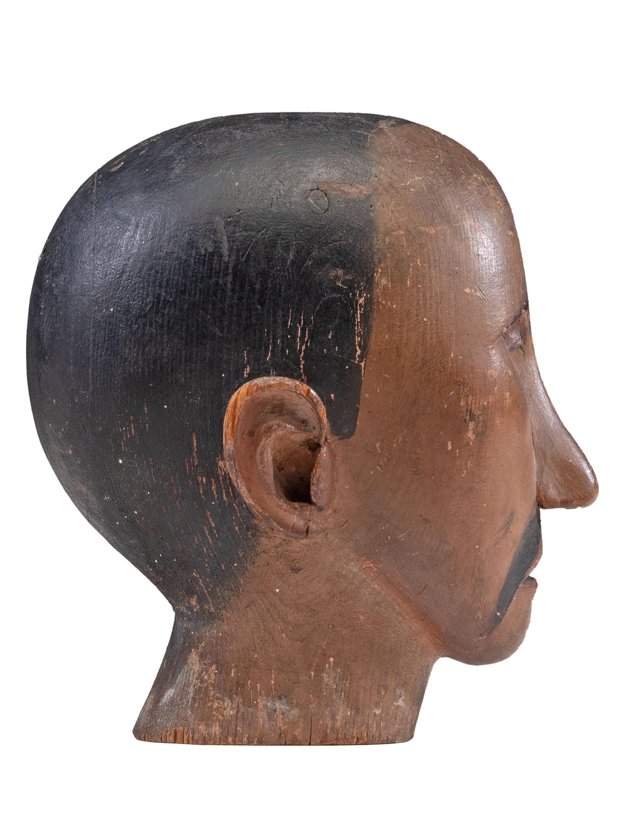A Folk Art Carved and Painted Pine Carnival Head