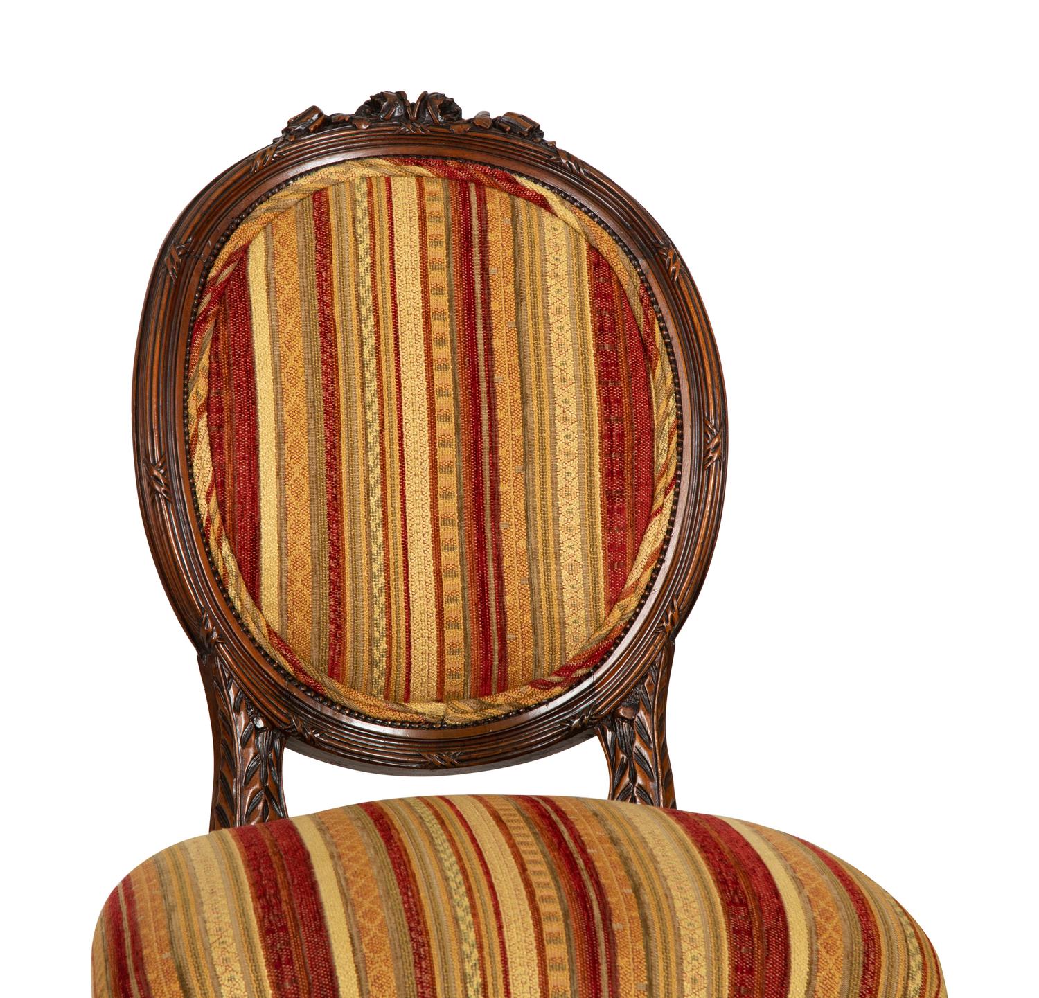 Four Louis XVI Style Carved Walnut Chairs