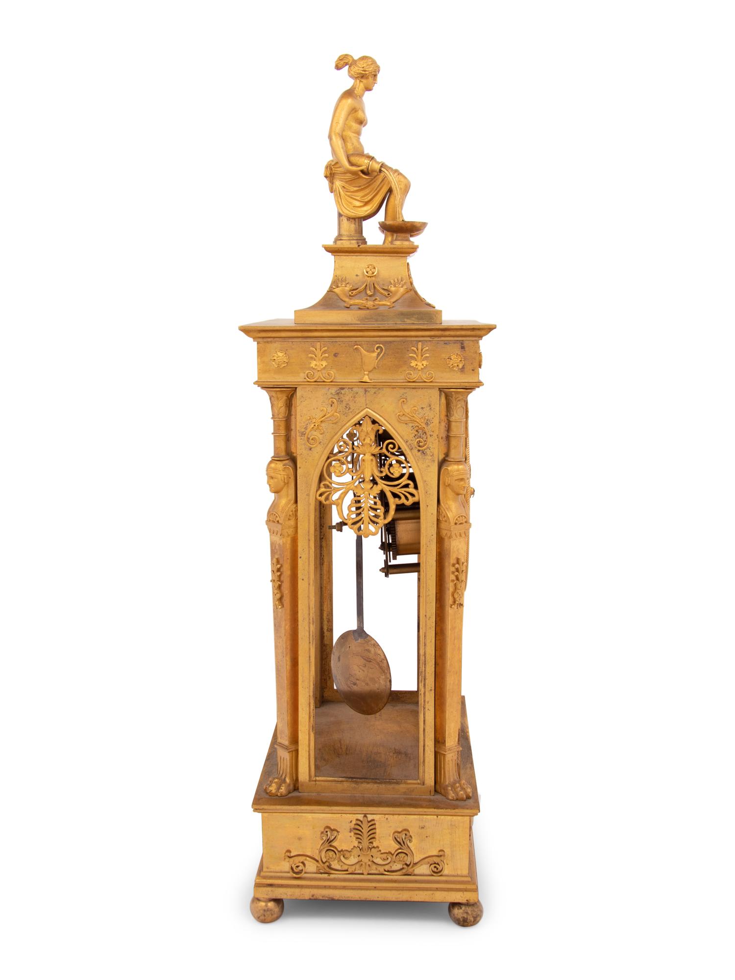 An Empire Gilt Bronze Figural Mantel Clock