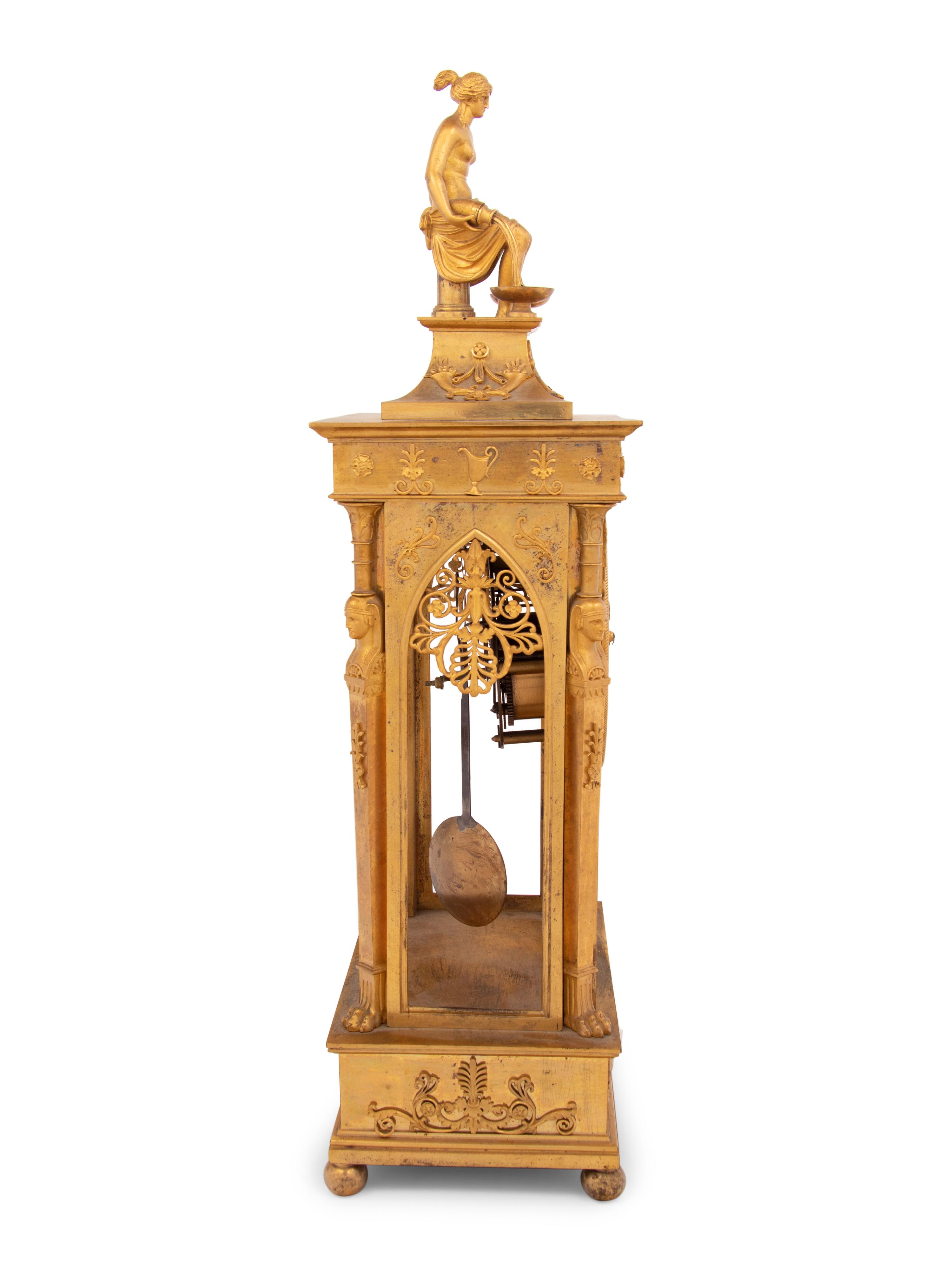 An Empire Gilt Bronze Figural Mantel Clock