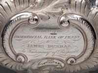 A Pair of American Repousse Silver Presentation Pitchers