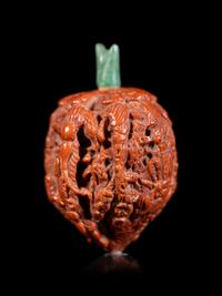 A Chinese Carved Peach Pit Snuff Bottle
