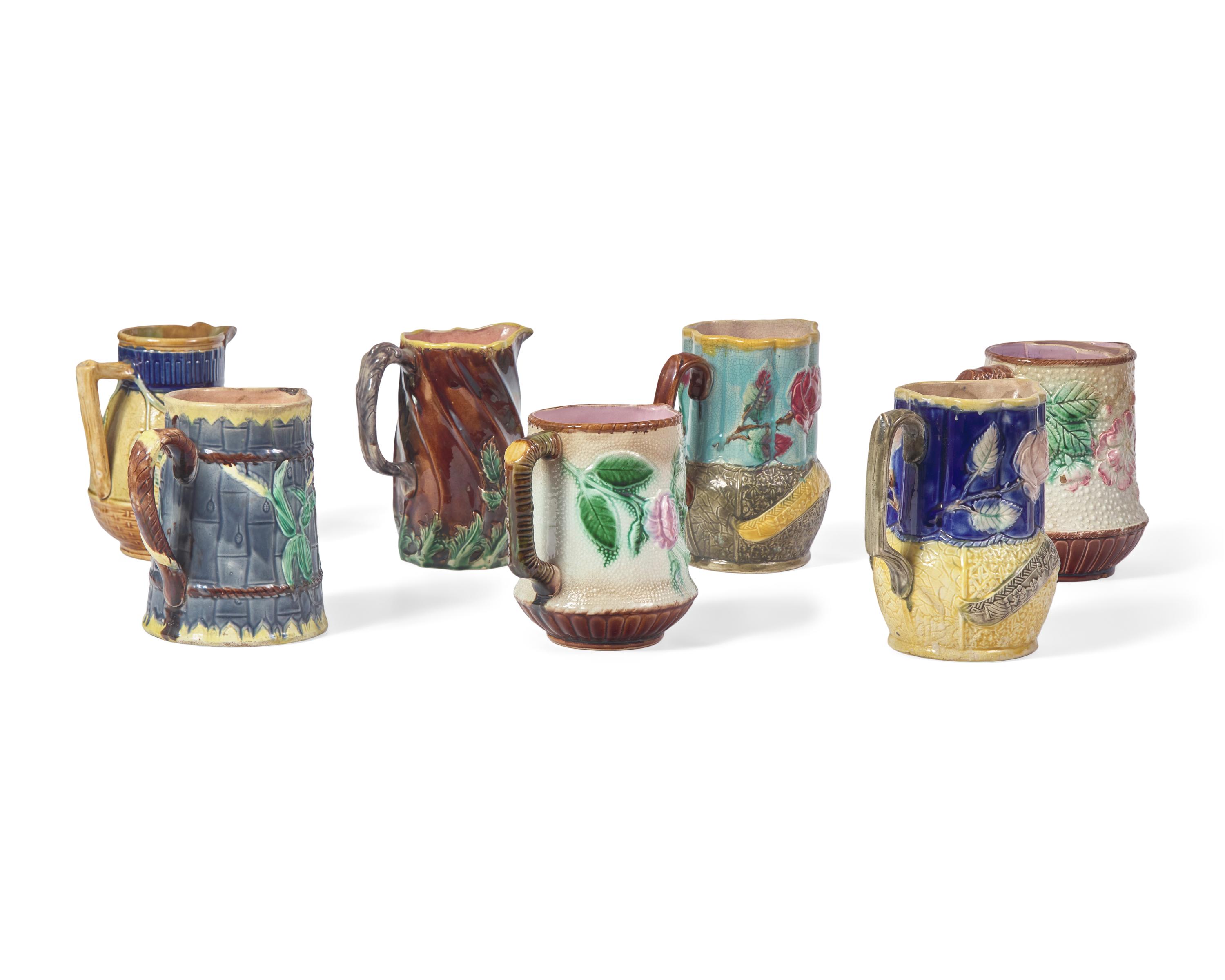 A Collection of Seven Majolica Pitchers