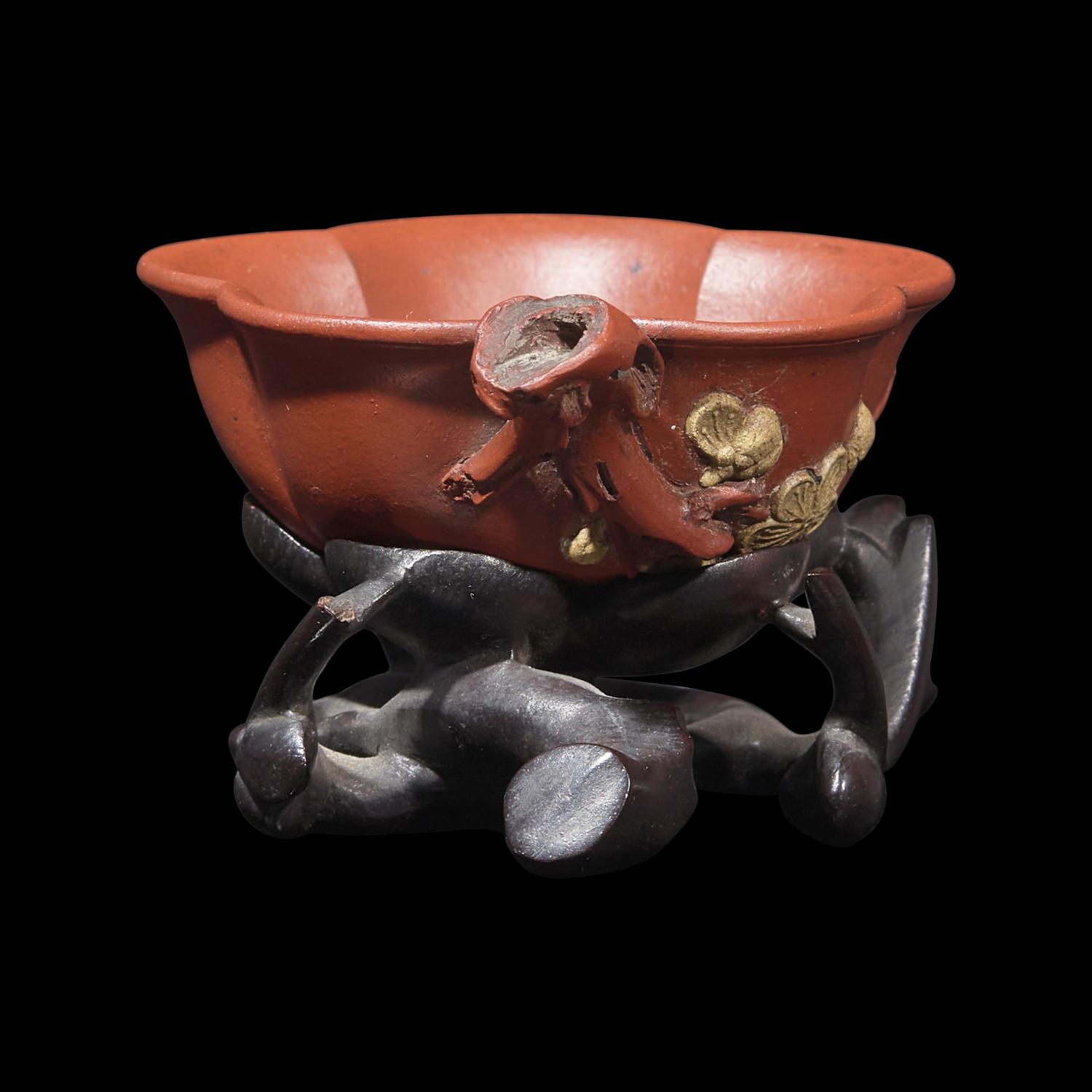 A Rare Yixing 'Prunus Blossom' Coupe with Impressed Seal 'Mingyuan', and Wood Stand 陳鳴遠款朱泥紫砂梅花杯
