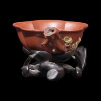 A Rare Yixing 'Prunus Blossom' Coupe with Impressed Seal 'Mingyuan', and Wood Stand 陳鳴遠款朱泥紫砂梅花杯