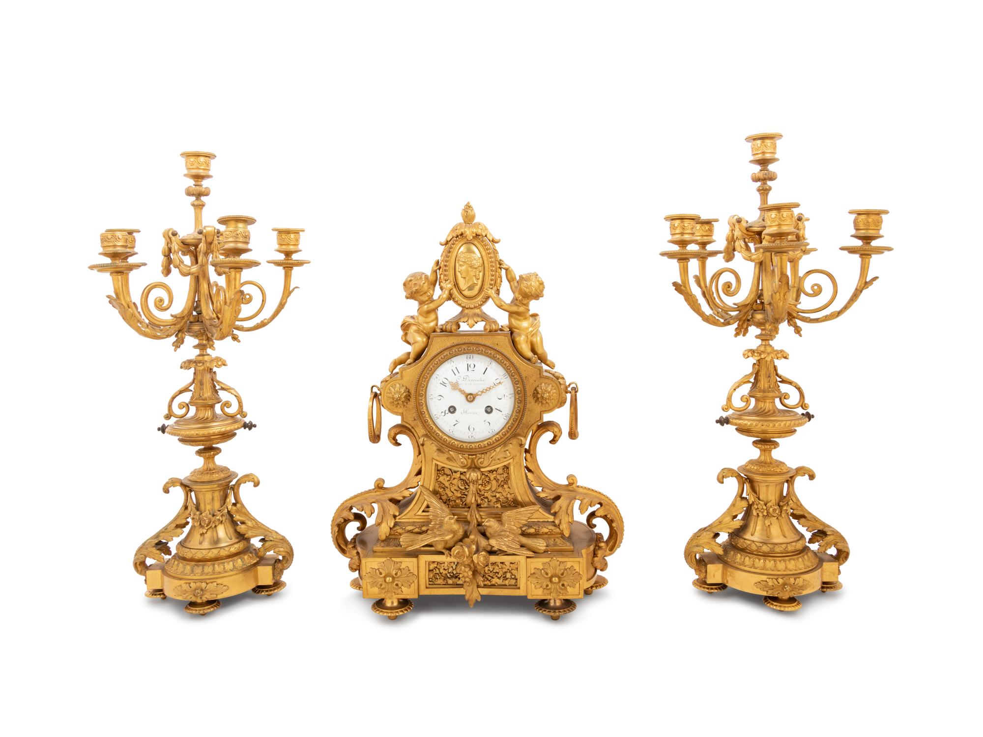 A Louis XVI Style Gilt Bronze Clock Garniture