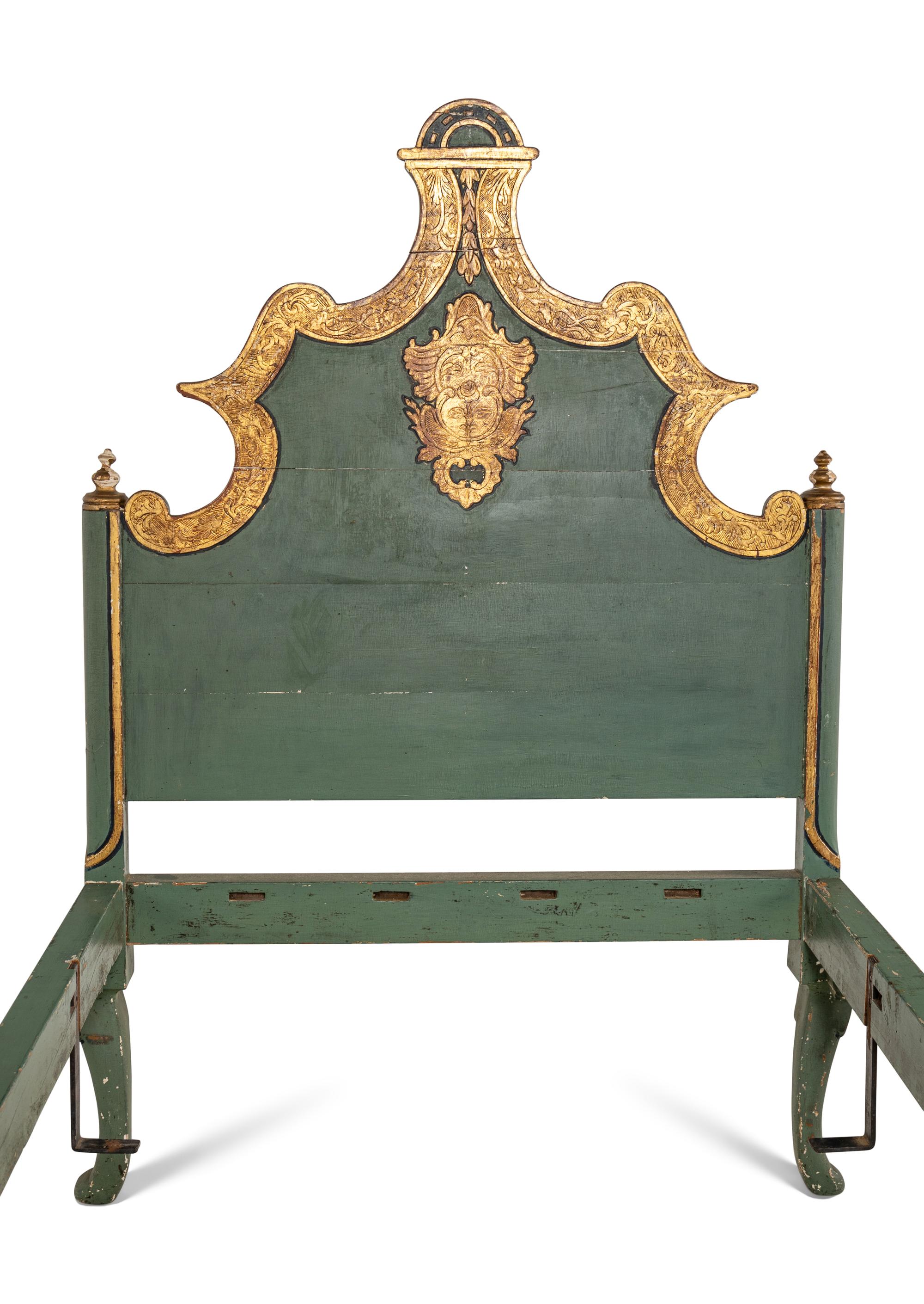 A Pair of Venetian Style Painted and Parcel Gilt Twin Beds