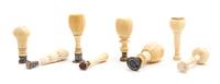 A Collection of Turned Ivory Seals, Height of tallest 4 1/4 inches.