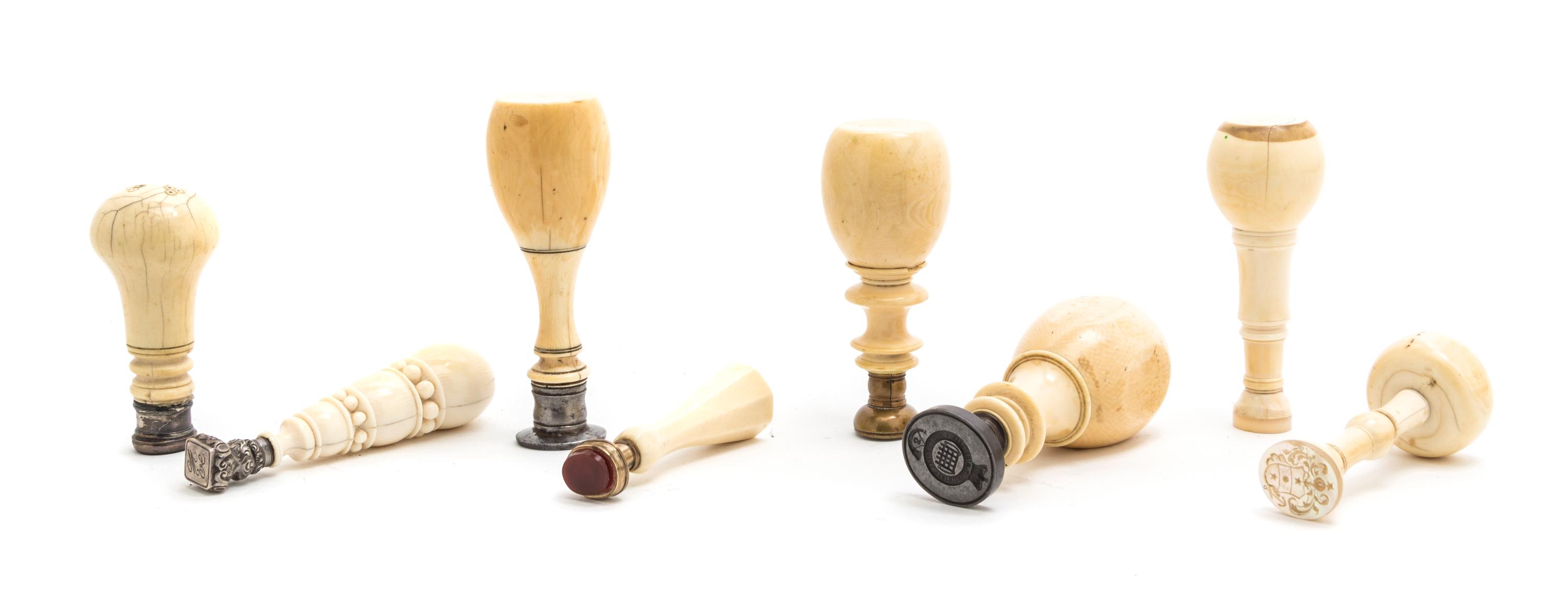 A Collection of Turned Ivory Seals, Height of tallest 4 1/4 inches.