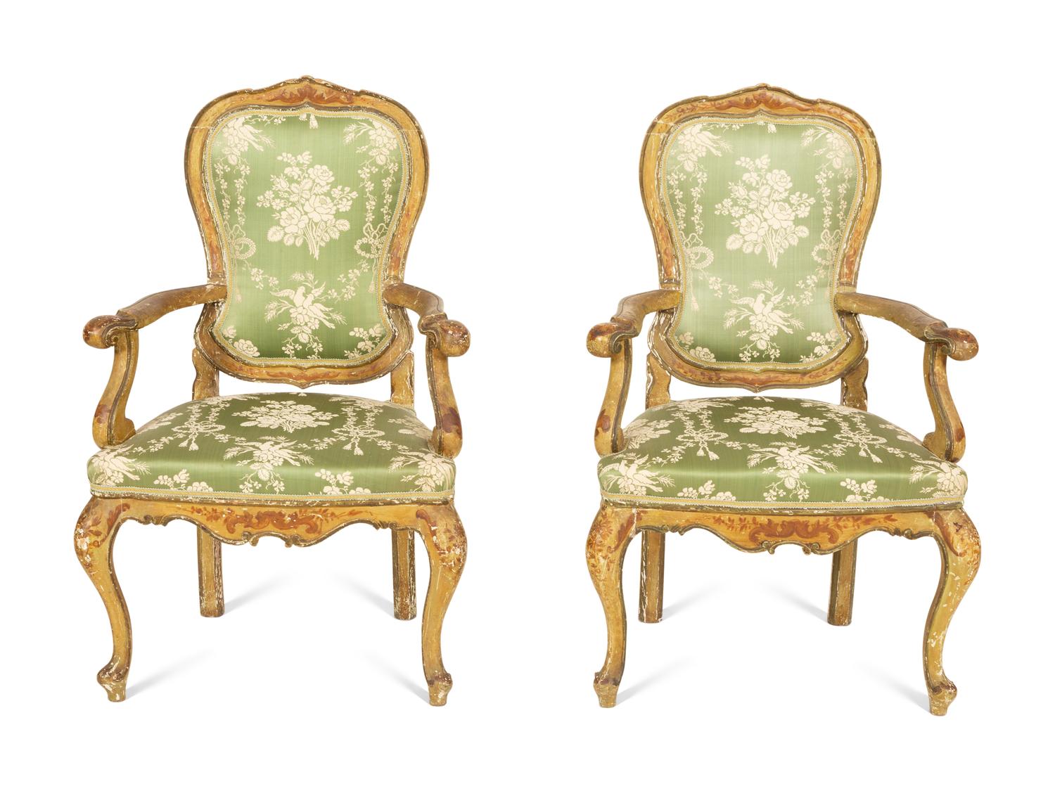 A Pair of Italian Painted and Parcel Gilt Open Armchairs