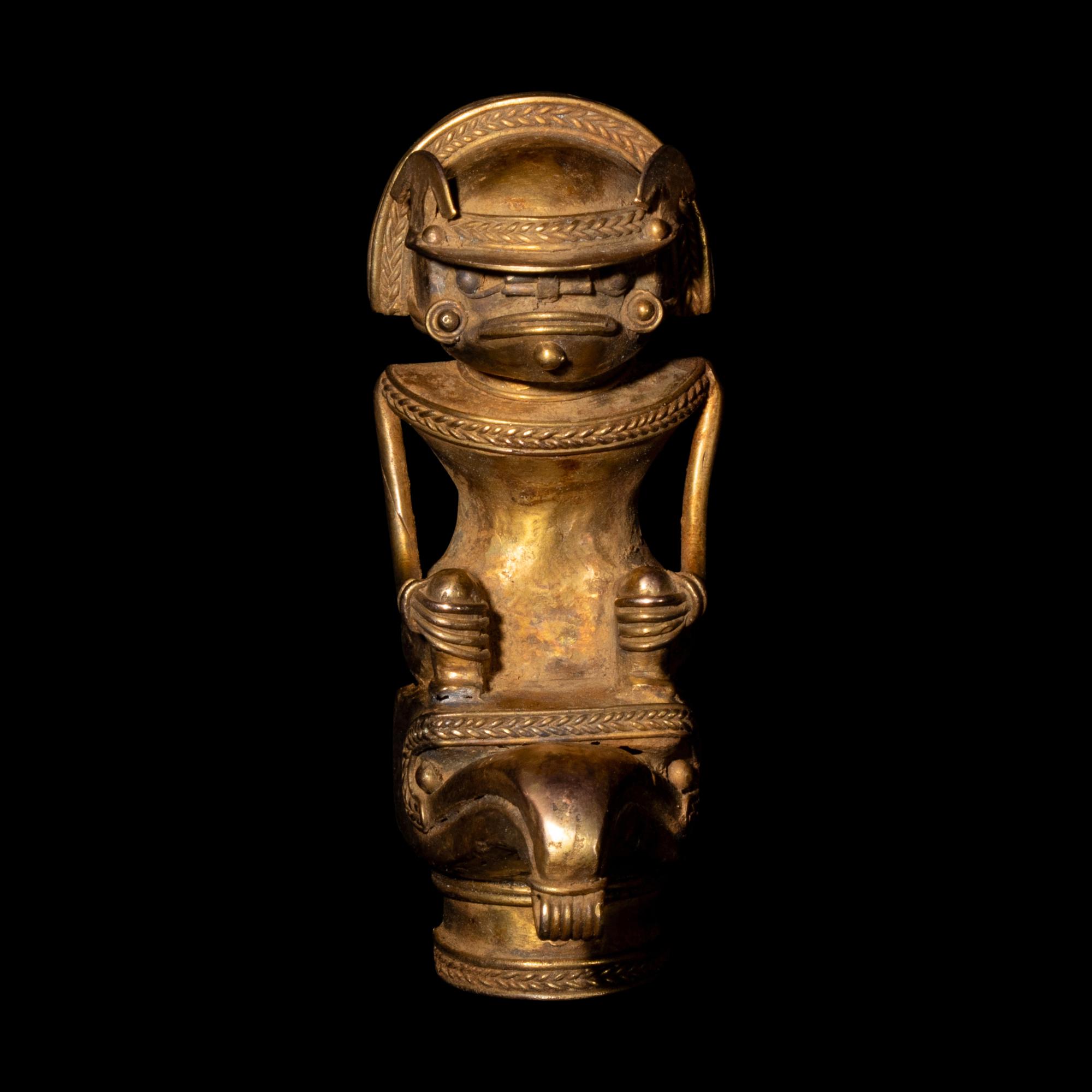 A Tairona Tumbaga Finial with a Shaman atop a Bird