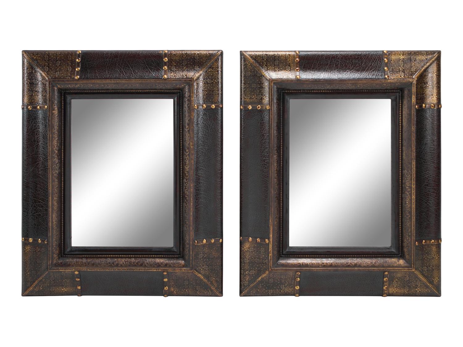 A Pair of Portuguese Style Embossed and Parcel-Gilt Leather Mirrors