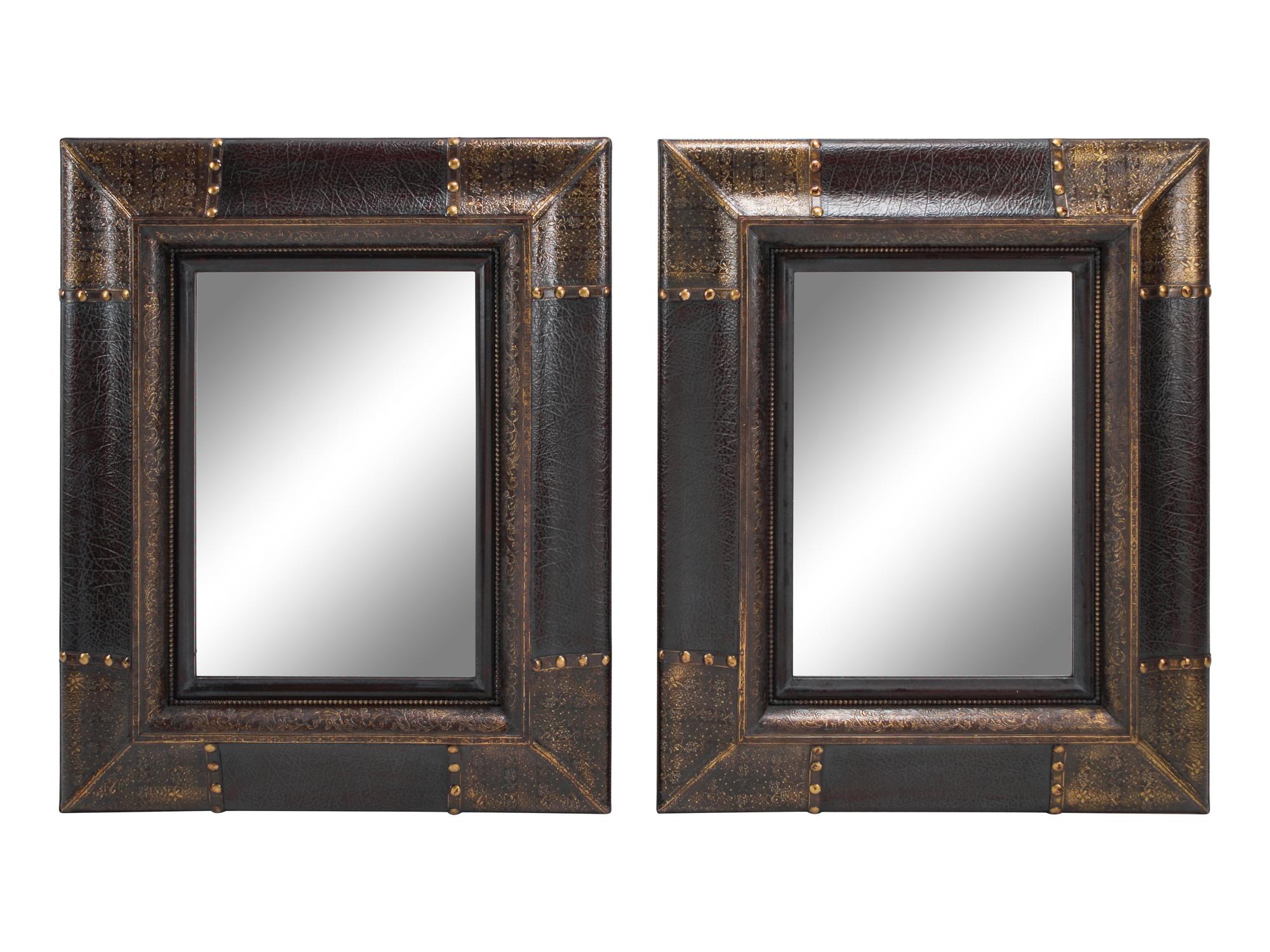 A Pair of Portuguese Style Embossed and Parcel-Gilt Leather Mirrors