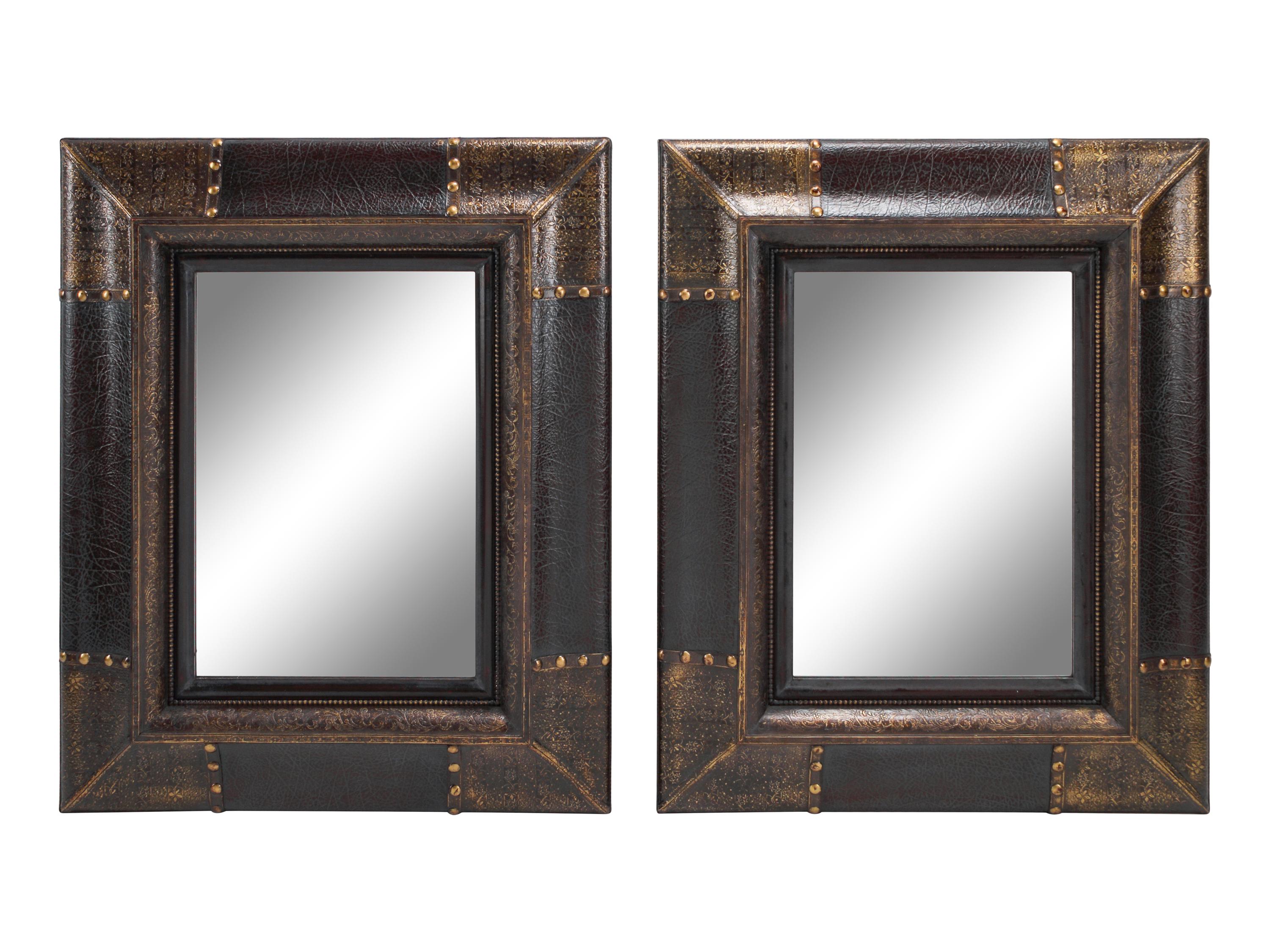 A Pair of Portuguese Style Embossed and Parcel-Gilt Leather Mirrors