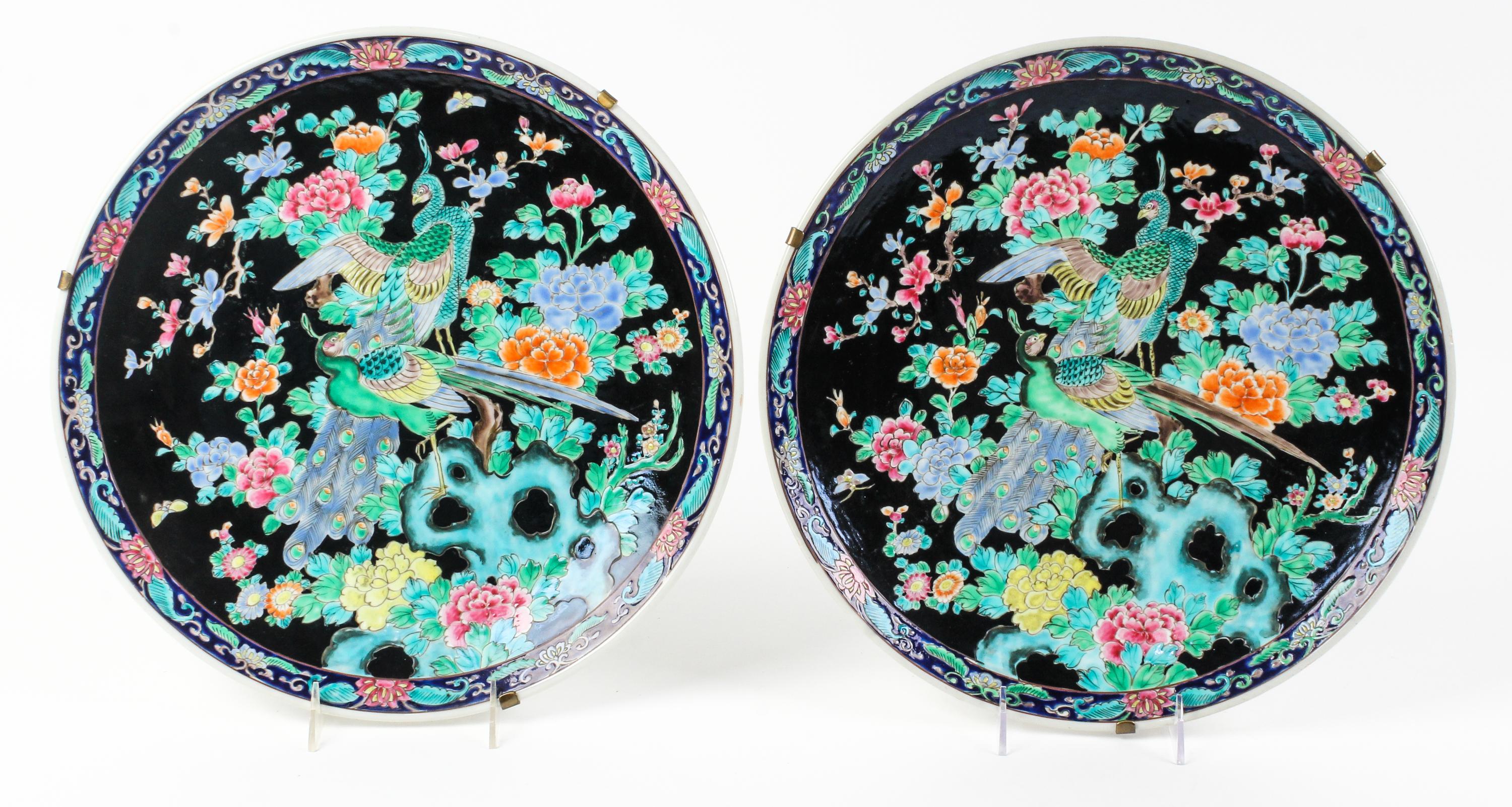 A Pair of Famille Noir Porcelain Chargers Diameter 14 1/2 inches. — 20TH CENTURY