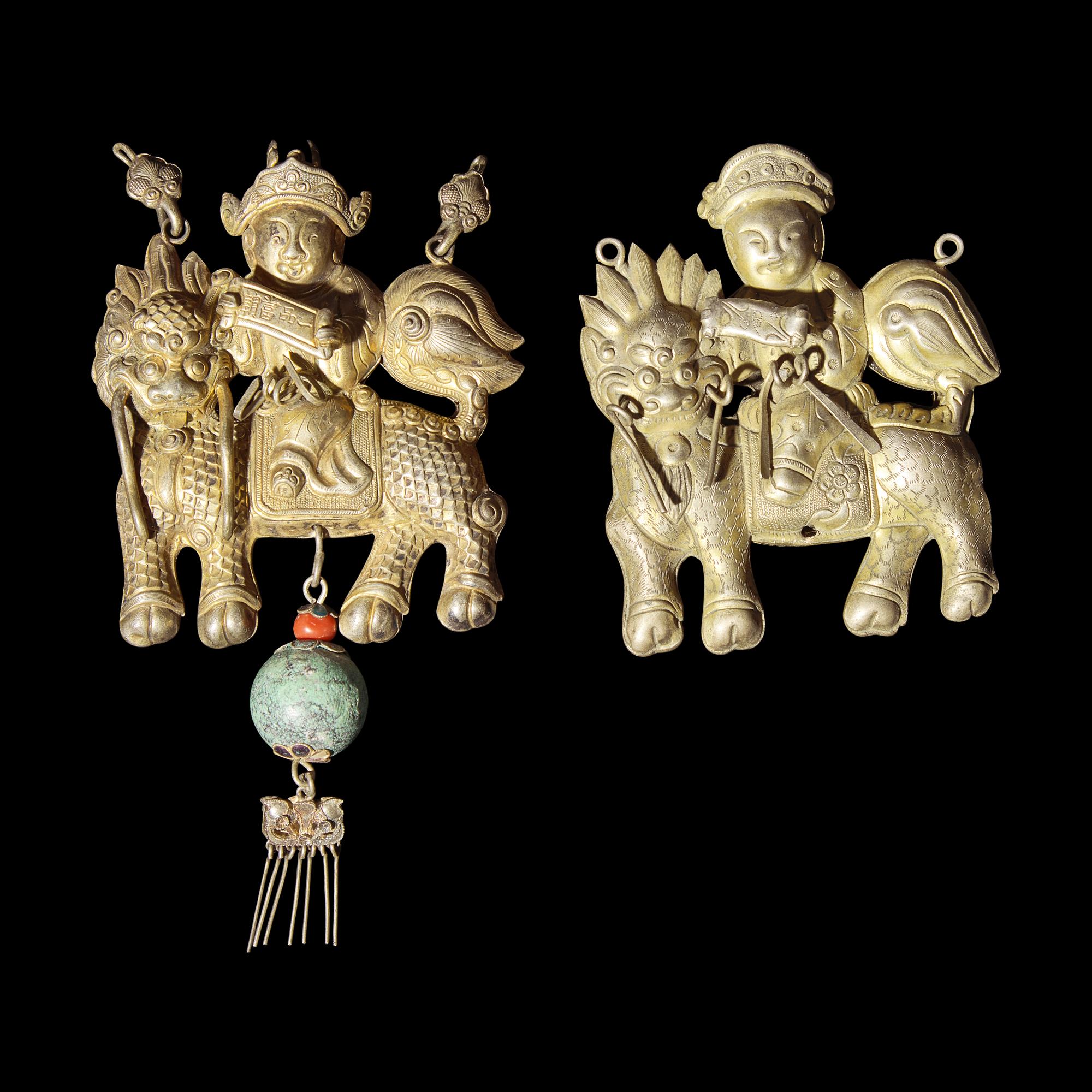 Eight Chinese Silver 'Boy and Qilin' Pendants, Late Qing Dynasty-Republic Period 晚清-民國 銀鍍金、銀燒藍及銀製麒麟送子長命鎖一組八件