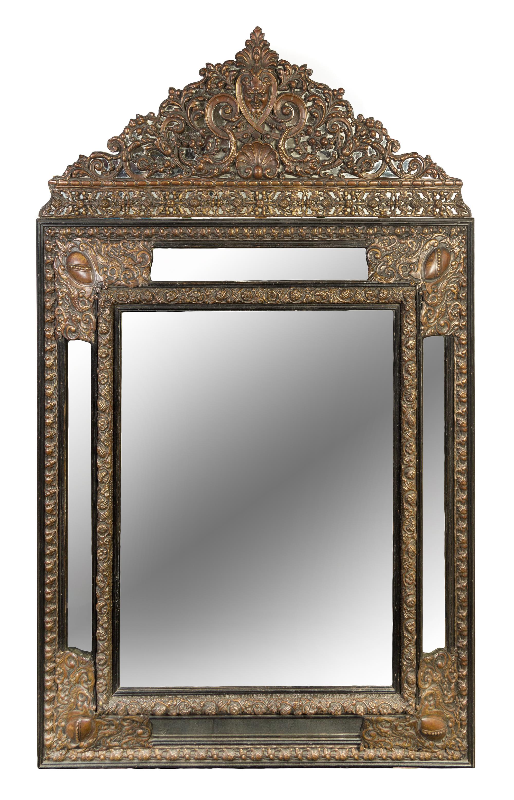 A Dutch Baroque Style Pressed Metal Mirror Height 65 x width 40 inches — 19TH CENTURY