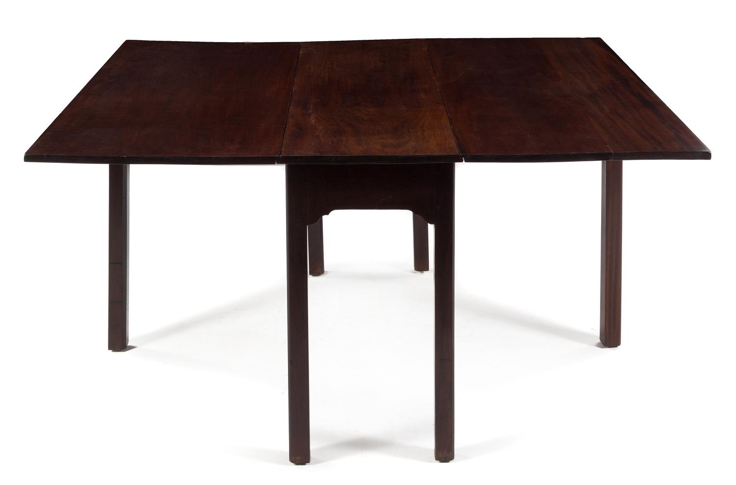 A George III Style Mahogany Drop-Leaf Table Height 28 1/2 x width 48 x depth 17 inches (closed). — 19TH CENTURY