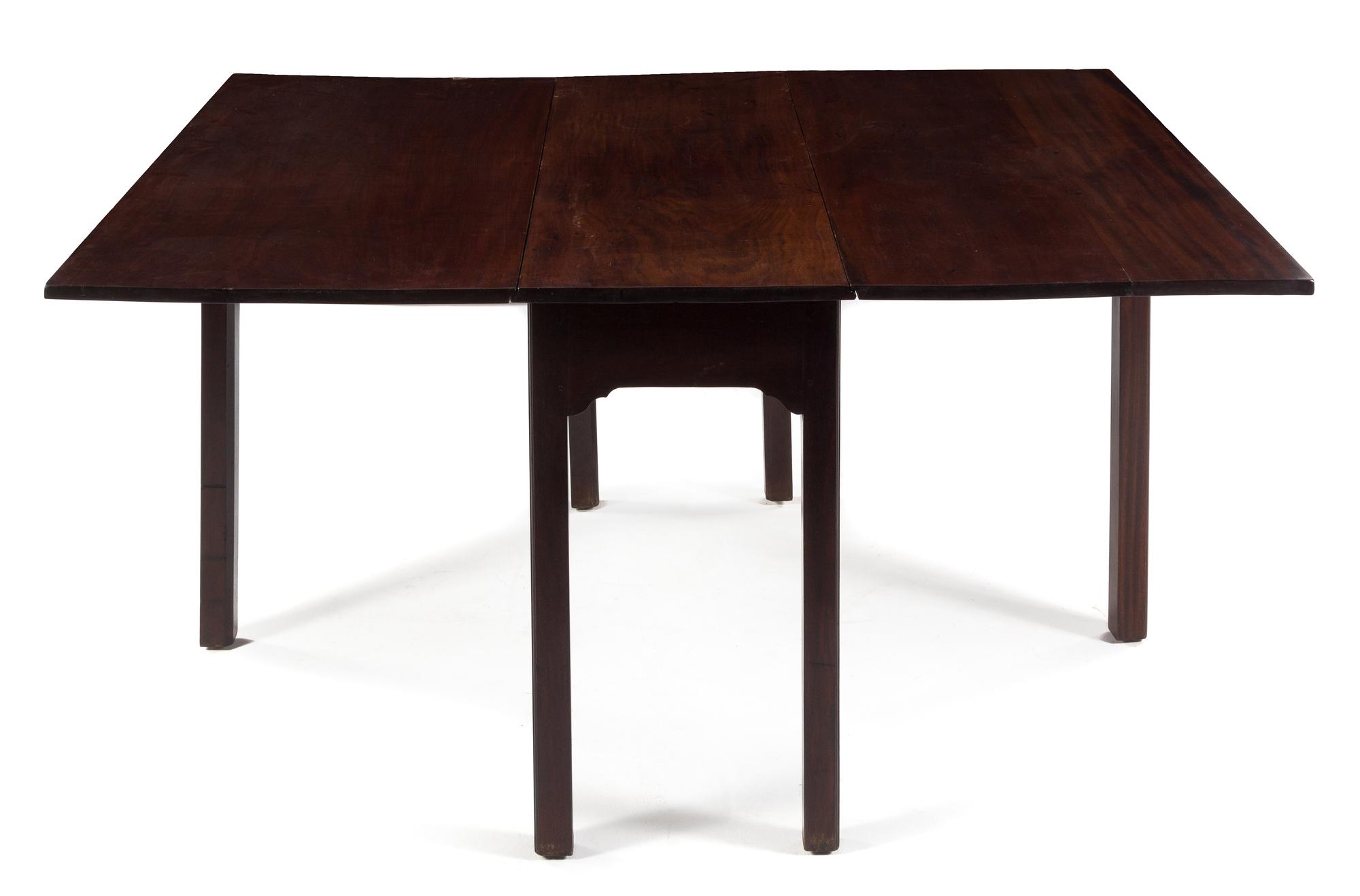 A George III Style Mahogany Drop-Leaf Table Height 28 1/2 x width 48 x depth 17 inches (closed). — 19TH CENTURY