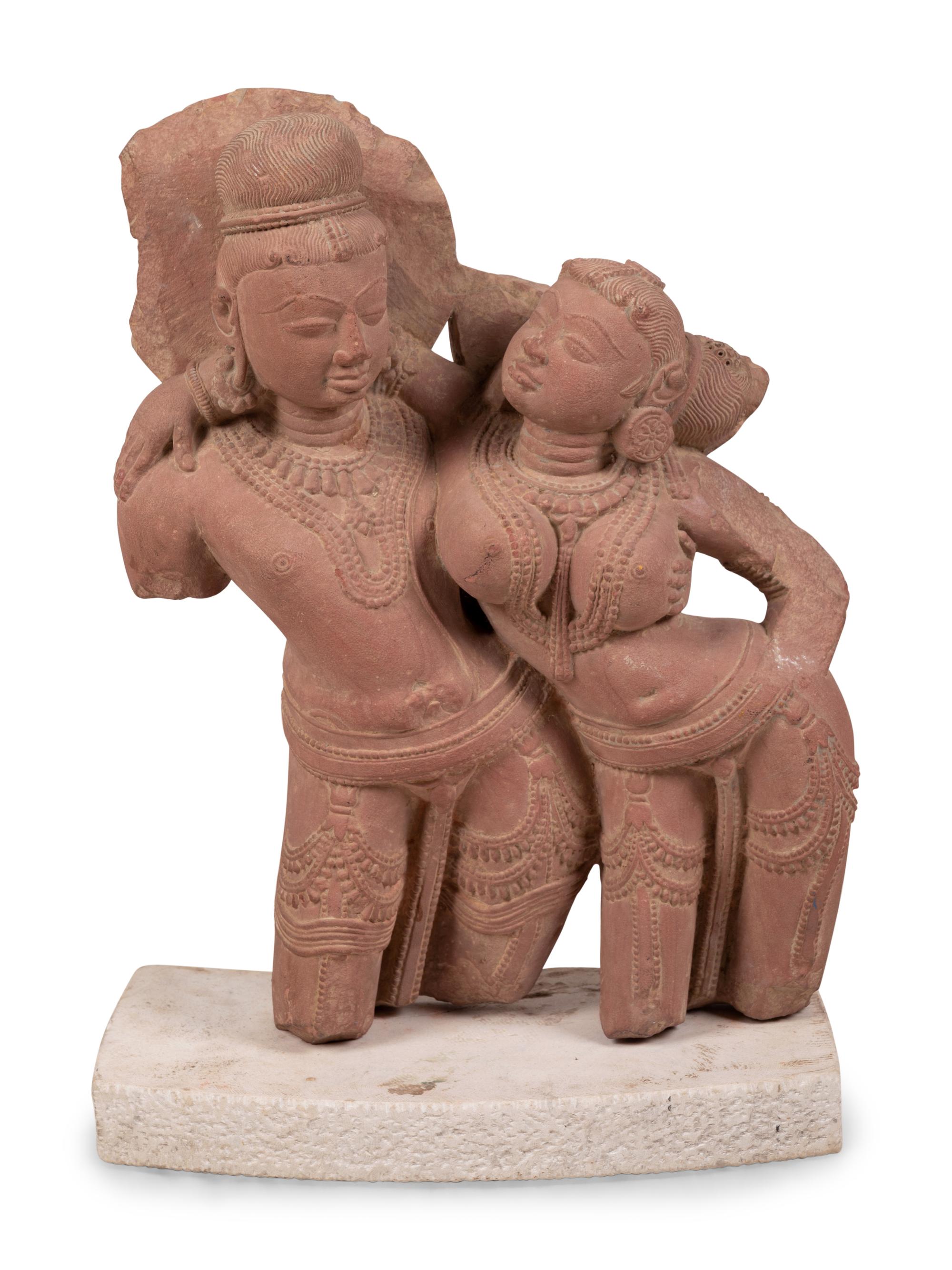 A Sandstone Figural Group